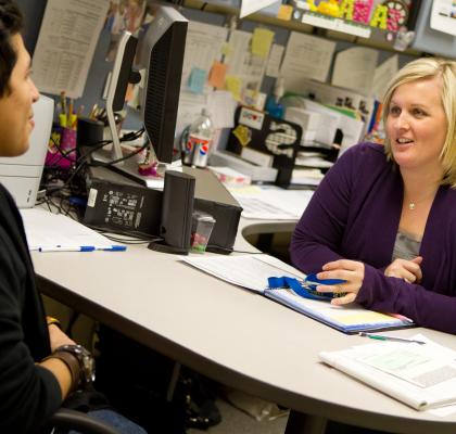 Female staff member meeting with student